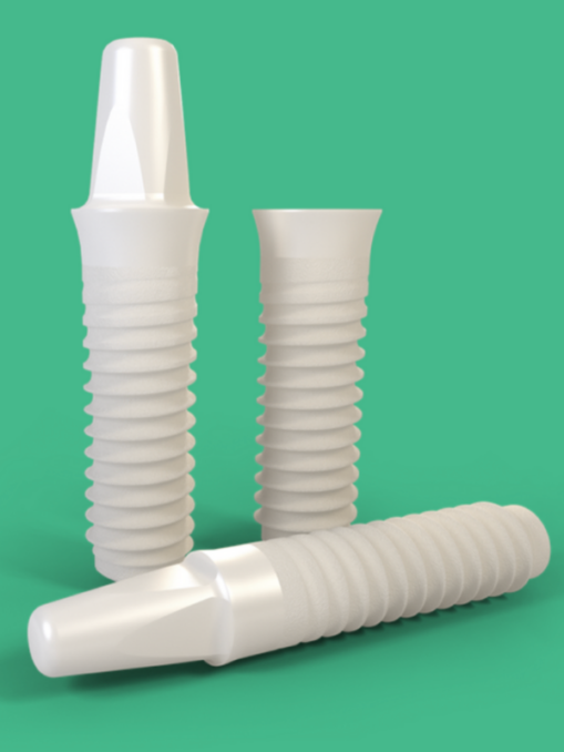 Three zirconia dental implants displayed against a green background, showing the design and structure of ceramic implants.